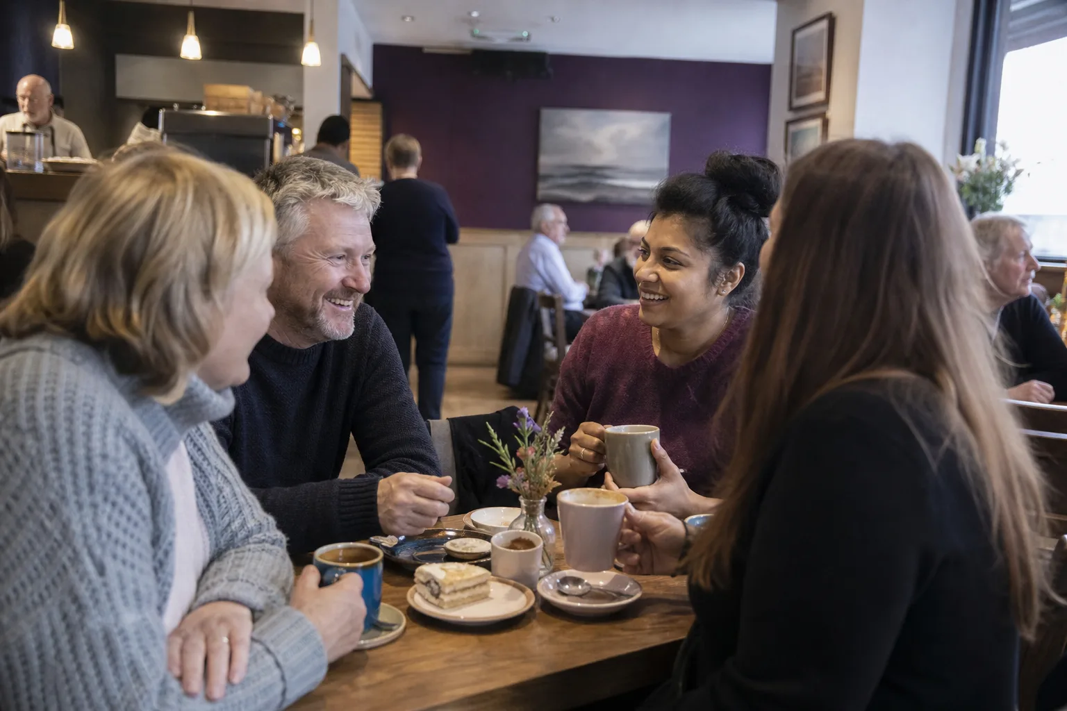 Adults chatting at an outdoor community event in East Lothian